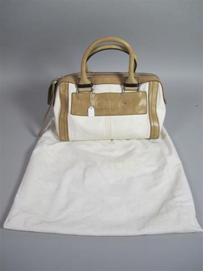 CHLOÉ
Sac porté main en cuir beige et toile...