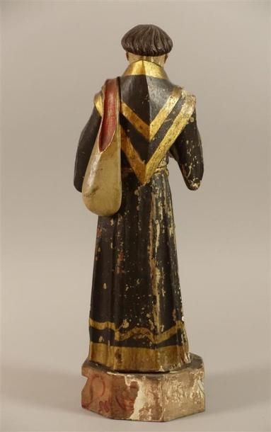 Saint personnage en bois sculpté peint.
Haut....
