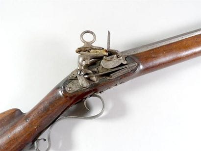 Fusil espagnol à silex.
Canon rond à pans...