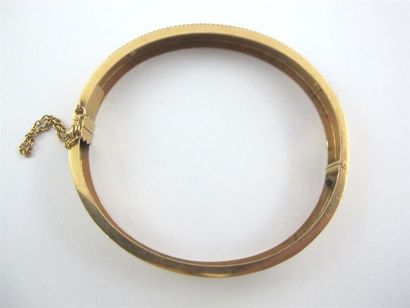 Bracelet rigide ouvrant en or jaune 750 millièmes,...