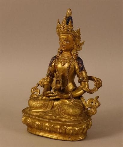 Bouddha en bronze doré.
Haut. : 22 cm ; Larg....