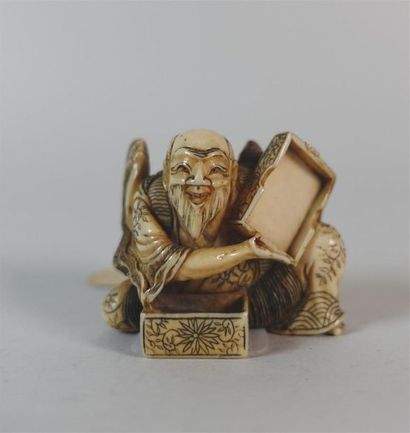 Netsuke en ivoire représentant un personage...