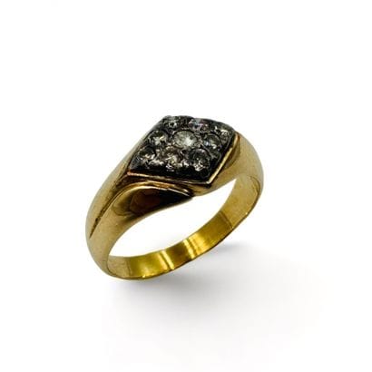 Bague en or jaune (750) et argent ornée de...