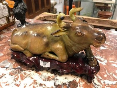 Green and brown hard stone buffalo

China

21...
