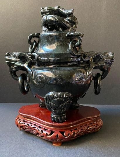 Covered pot surmounted by a black hard stone...