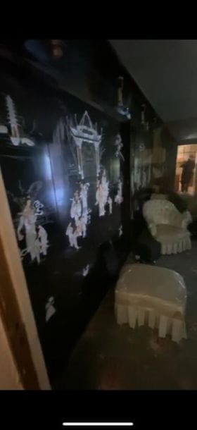 Large black lacquered wooden screen decorated...