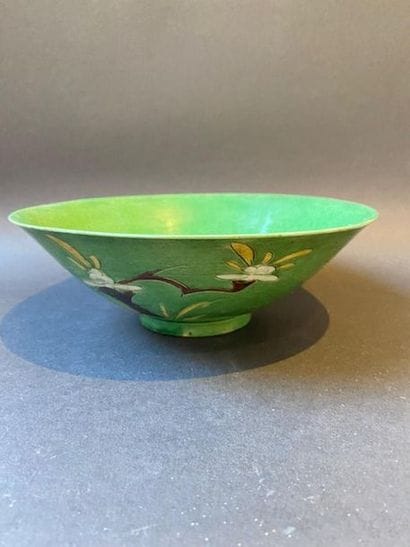 Flared bowl of green porcelain with plant...