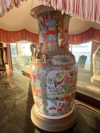 Canton porcelain vase decorated with characters.

China,...
