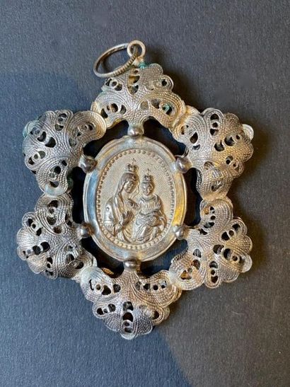 Silver filigree medallion from the 17th century...