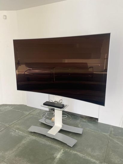 SAMSUNG curved TV with its stand 
(sold as...
