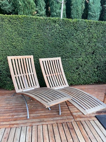 Pair of teak and metal recliners by SUNWOOD...