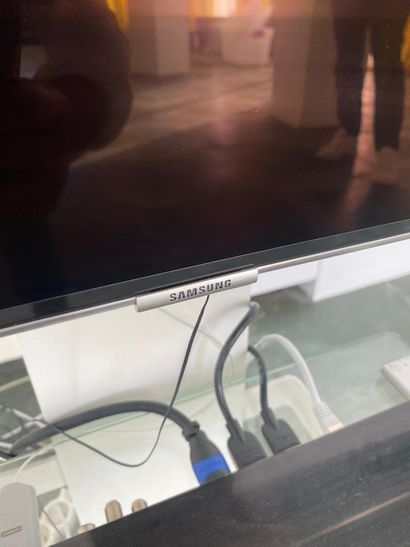 SAMSUNG curved TV with its stand 
(sold as...