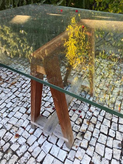 Large glass tray resting on two wooden trestles...