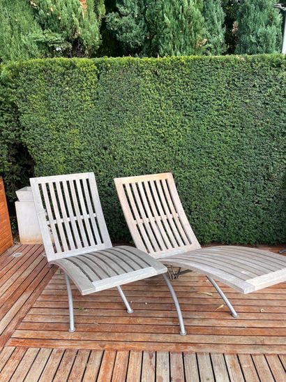 Pair of teak and metal recliners by SUNWOOD...