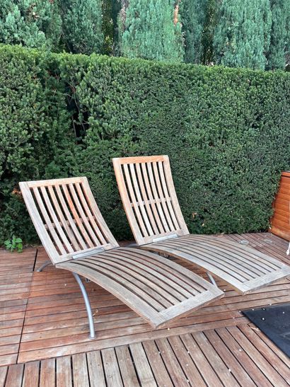 Pair of teak and metal recliners by SUNWOOD...