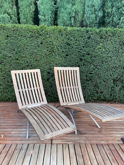 Pair of teak and metal recliners by SUNWOOD...