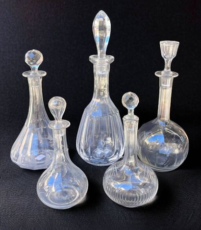 Set of five crystal decanters. 
H: 36 cm...