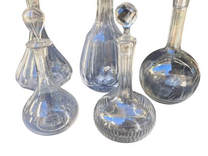 Set of five crystal decanters. 
H: 36 cm...
