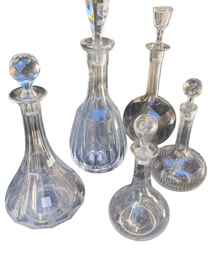 Set of five crystal decanters. 
H: 36 cm...