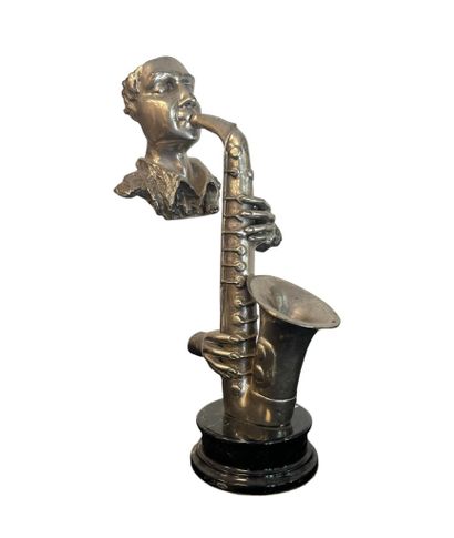 Silver-plated regule saxophonist silhouette...