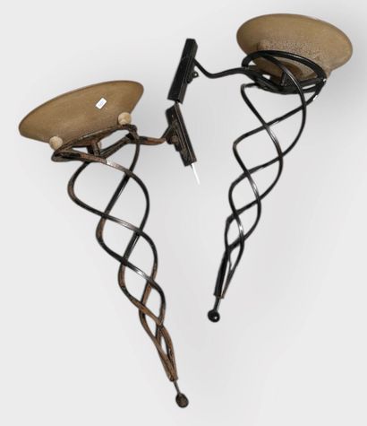 Pair of wrought-iron sconces supporting a...