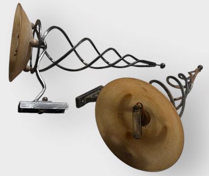 Pair of wrought-iron sconces supporting a...
