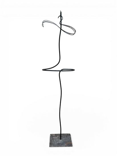 Free-form, patinated wrought-iron valet.
Three...