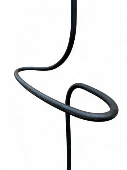 Free-form, patinated wrought-iron valet.
Three...