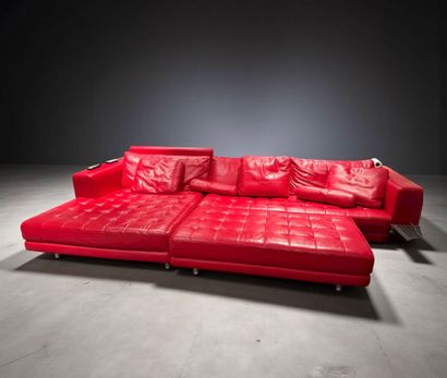 Large sofa upholstered in red leather.
With...