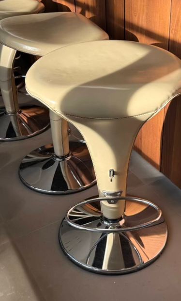 Set of 4 barstools resting on chrome-plated...
