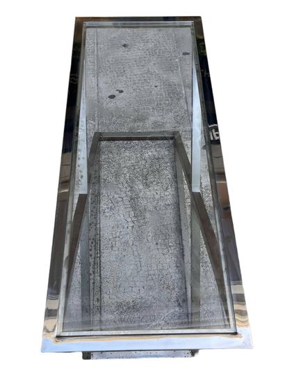 Chrome-plated metal console with glass top.
Circa...