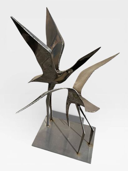 Stainless steel sculpture of a pair of birds...