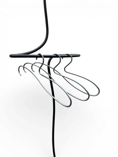 Free-form, patinated wrought-iron valet.
Three...