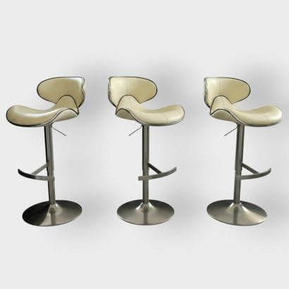 Set of 3 bar chairs resting on chrome-plated...