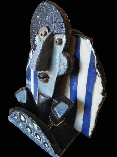 Glazed ceramic sculpture of a blue, black...