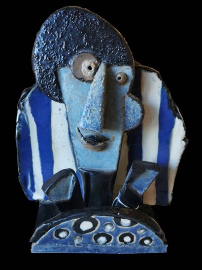 Glazed ceramic sculpture of a blue, black...