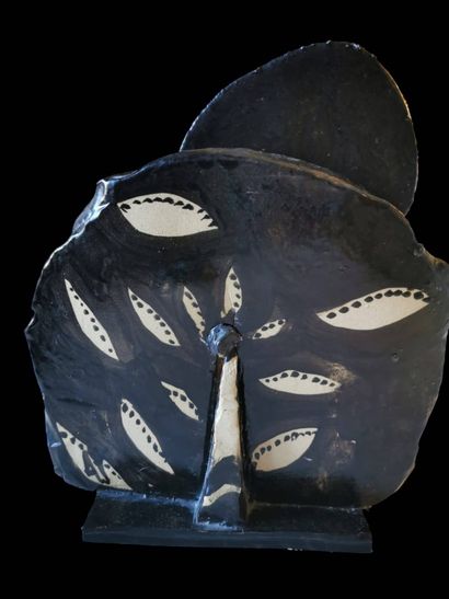 Glazed ceramic sculpture of a blue, black...