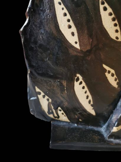 Glazed ceramic sculpture of a blue, black...