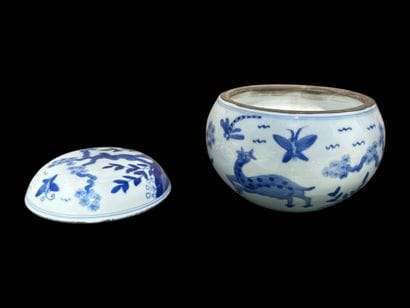 Porcelain covered pot decorated with plants...