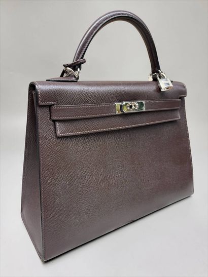 HERMÈS
Rigid Kelly model handbag in chocolate...