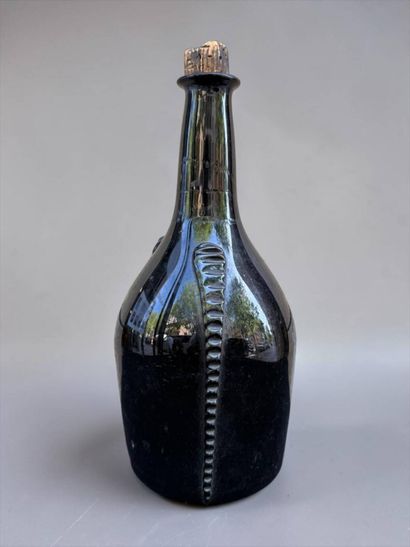 Brown blown glass bottle 
18th century
Height:...
