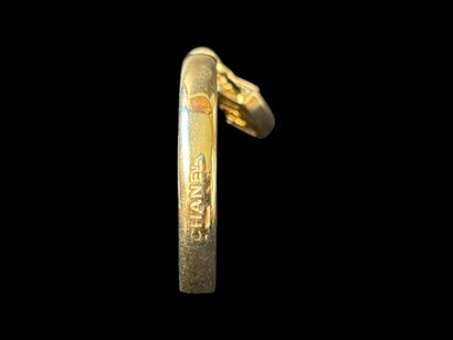 CHANEL
Rigid bangle in silver-plated metal,...
