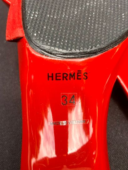 HERMÈS
Pair of lacquered wood and red suede...