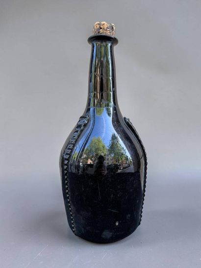 Brown blown glass bottle 
18th century
Height:...