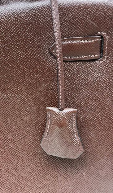 HERMÈS
Rigid Kelly model handbag in chocolate...