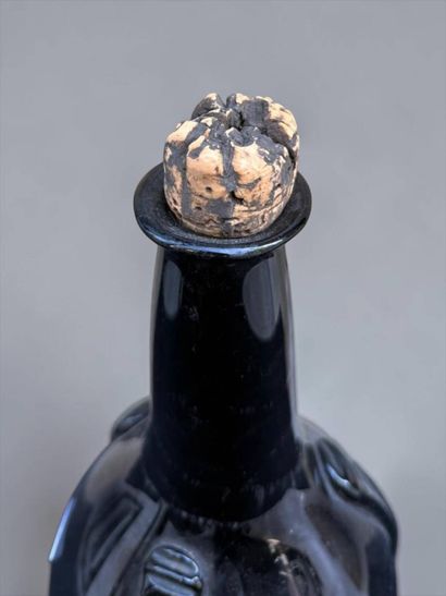 Brown blown glass bottle 
18th century
Height:...