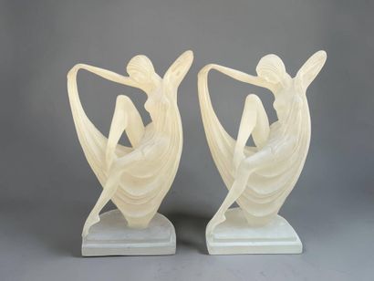 Pair of lucite lamps featuring a draped nude...