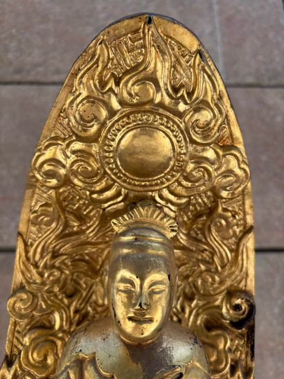 Asian divinity in carved and gilded wood
Height:...