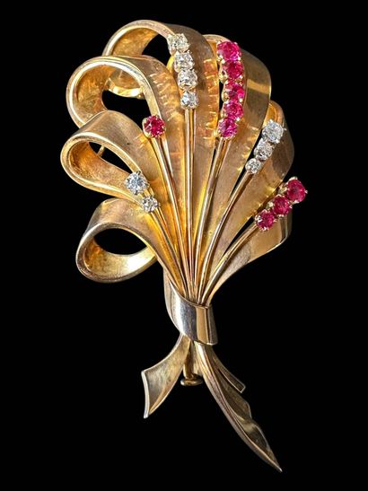 Spraying brooch in 750°/°° (18 k) yellow...