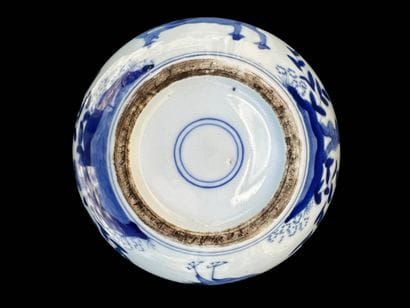 Porcelain covered pot decorated with plants...